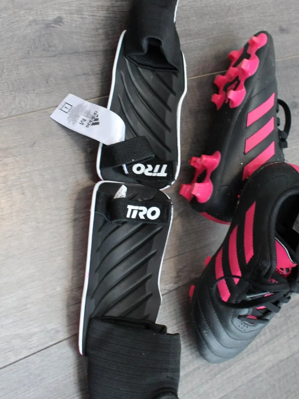 Adidas soccer cleats and shin guards